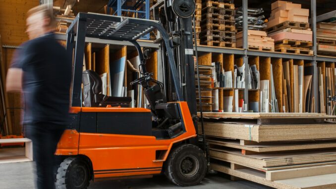 Photo by Pickawood yellow and black fork lift